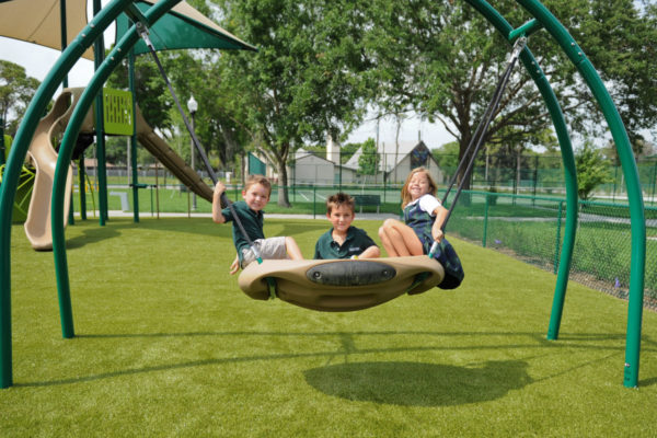 Kids playing on tire swing